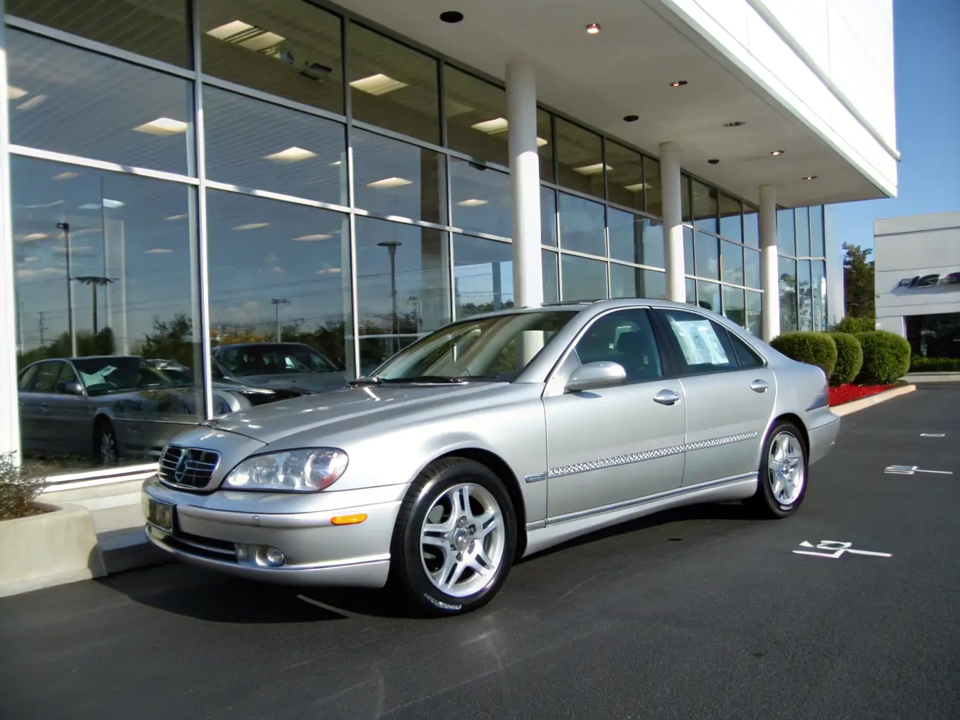 A sleek image of a BMW 3 Series sedan at a US car auction, highlighting its elegant design and luxurious features. The car is parked among other high-end vehicles.